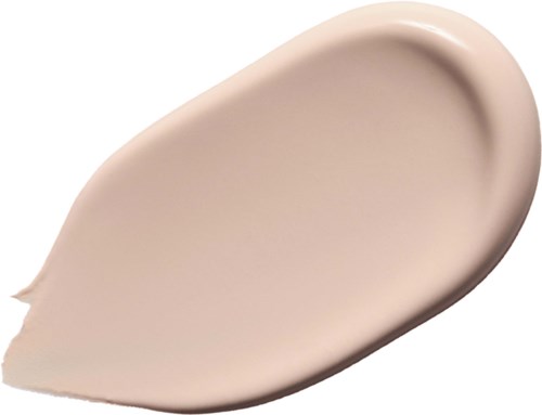 Ett beige flytande basstift med slät, krämig konsistens.