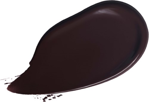 En mörk, glänsande vätskeutspillning på en vit yta, formad som en tårdroppe.