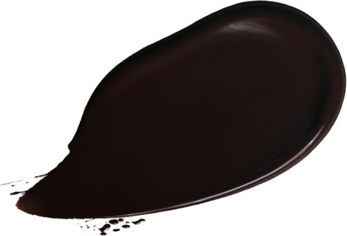 En svart vätska eller färgspill på en vit yta.