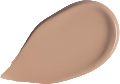 En dropplik av beige vätska, troligen foundation eller concealer, på en vit bakgrund.
