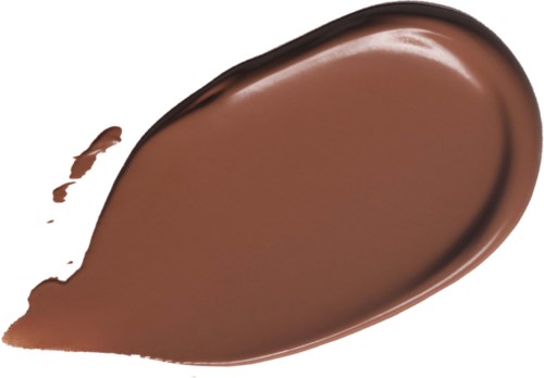 En stor fläck av slät, glänsande mörk choklad med en liten stänk bredvid.