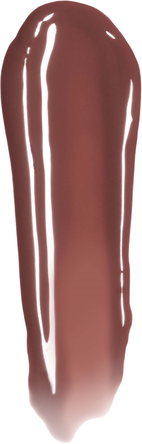 Een close-up van een gladde, glanzende beige lipstick-swatches op een witte achtergrond.