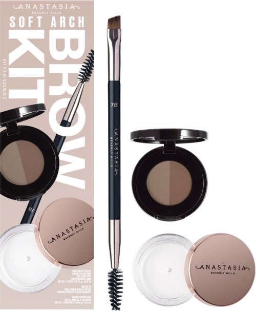 En makeup sats består av en borste, ögonbrynsduo och två ögonskuggspottar i beige- och bruna nyanser.