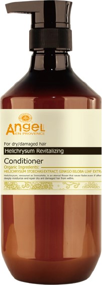 En brun flaska med pump, märkt Angel balsam för torrt, skadat hår med ört ingredienser.