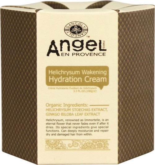 En kubformad förpackning av Angel Provence återfuktningskräm med naturliga ingredienser och design i guld och brunt.