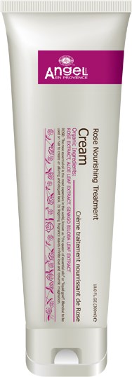 En vit tub med lila och rosa text, märkt Angel Rose Nourishing Treatment för ansikte och kropp.