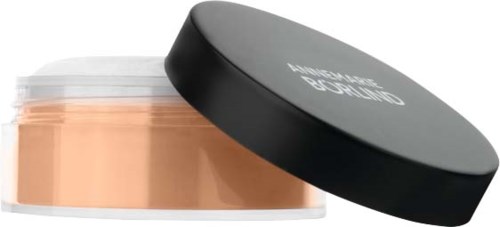 A jar of face foundation with a black lid, labeled 'Nothing But Face' on the lid.