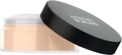 En rund makeup-beholder med svart lokk og lyst pulver inni.