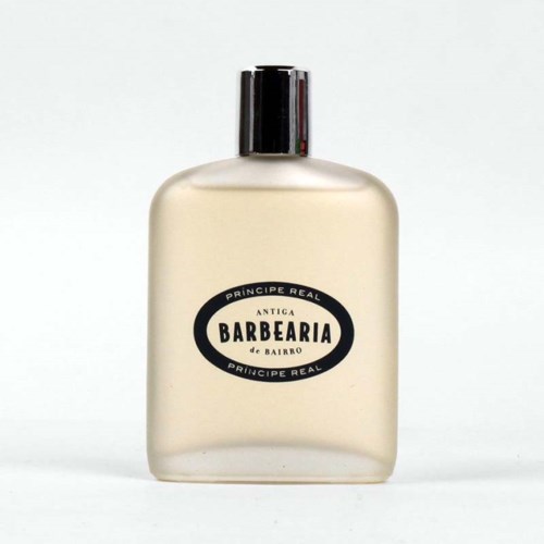 Een fles met een zwart deksel en een etiket met 'Barbearia de Bairo'.