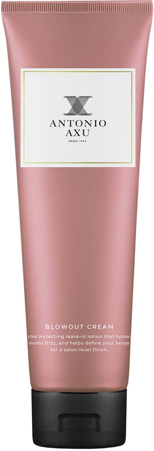 En rosa tub av Antonio Axu Blowout Cream med svart lock, visar produktetiketten och beskrivningen.
