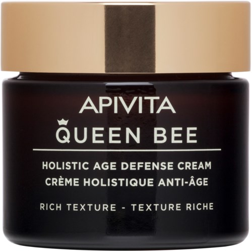 En svart burk med ett guldlock, märkt 'APIVITA QUEEN BEE' och nämner att det är en helhetlig anti-aging kräm.