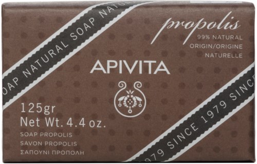 Brunt tvålpaket märkt Apivita, naturliga ingredienser, 125 gram, med dekorativ design och text om ursprung.