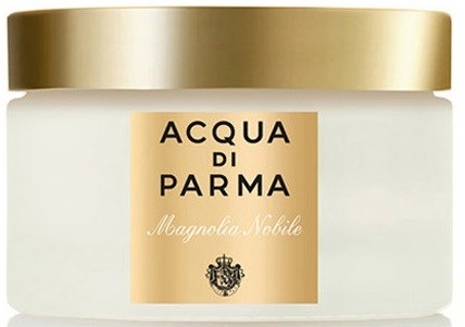En hvit krukke med gulltopp og en etikett som sier 'Acqua di Parma Magnolia Nobile'.