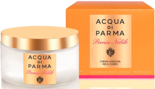 En burk med kroppssmör och orange paket märkta Acqua di Parma Peonia Nobile.