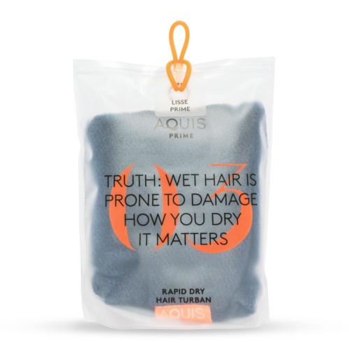En hårtorkprodukt i genomskinlig förpackning med svart och orange text och en stor orange design.