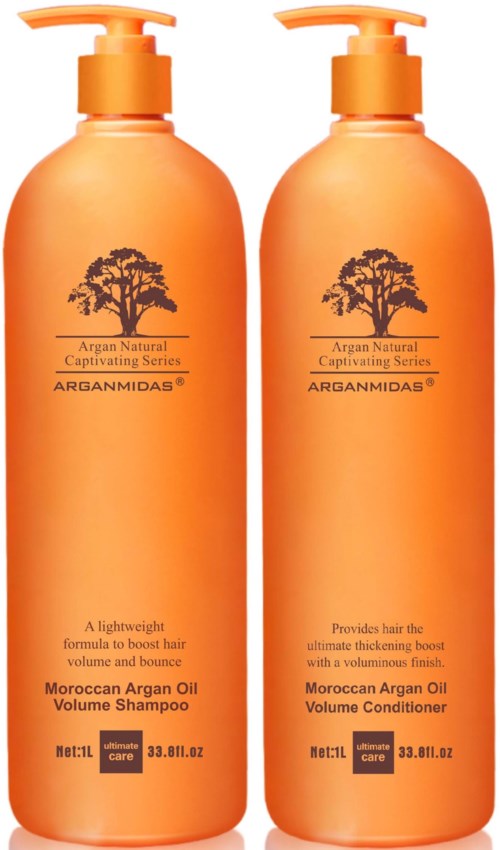 Two orange bottles of Arganmedas Moroccan Argan Oil hair care products, one is shampoo and the other is conditioner.