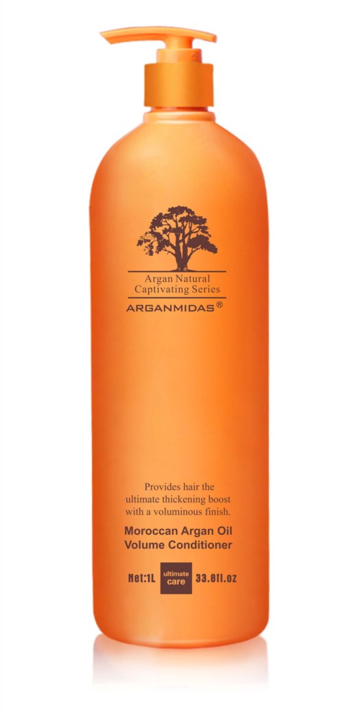 En orange flaska med pump, märkt Moroccan Argan Oil Volume Conditioner, med en trädlogga och produktuppgifter.