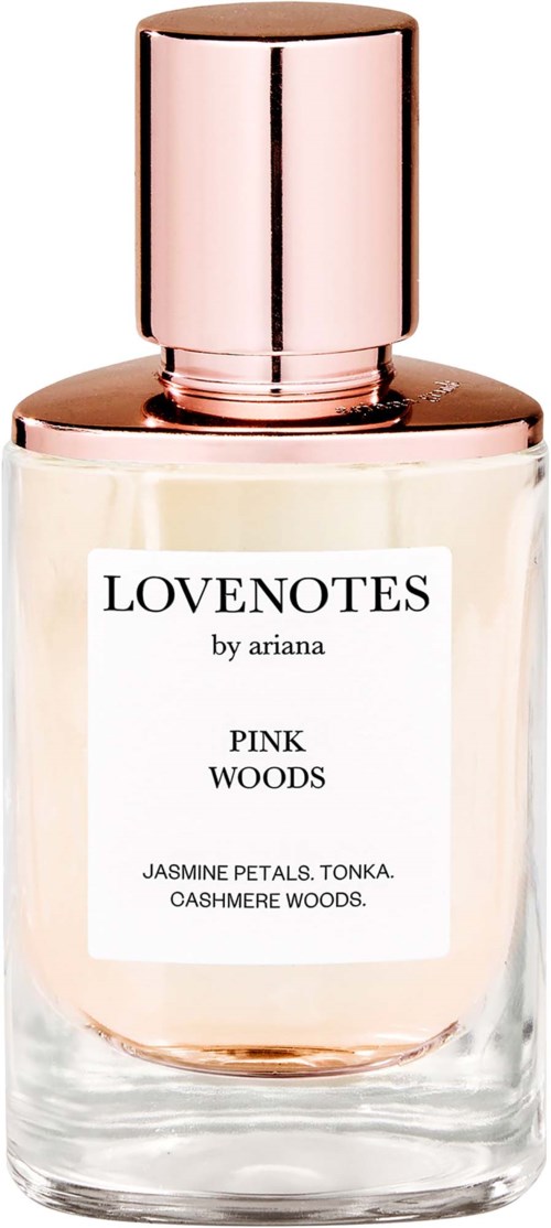 Glaspafume flaske med pink væske og rosaguld hætte, etiketten siger Lovenotes af Ariana Pink Woods med jasmin, tonka og cashmere woods.