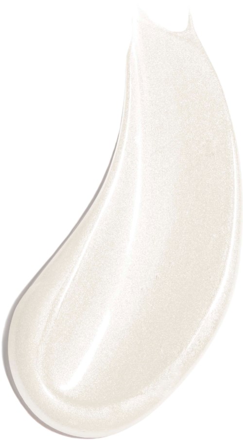 En virvel av vit kräm eller lotion på en vit bakgrund, som liknar en tårform.