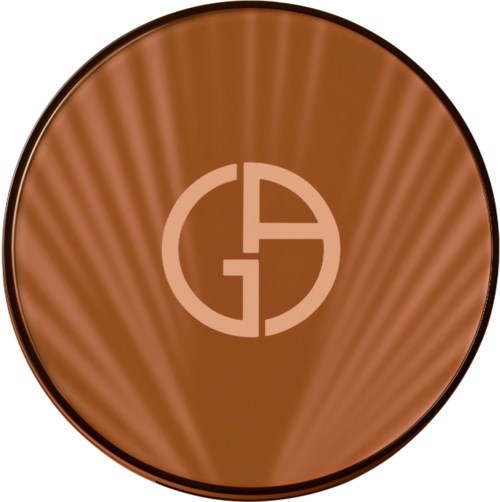 The image shows a round, brown object with a logo in the center containing letters G and A.