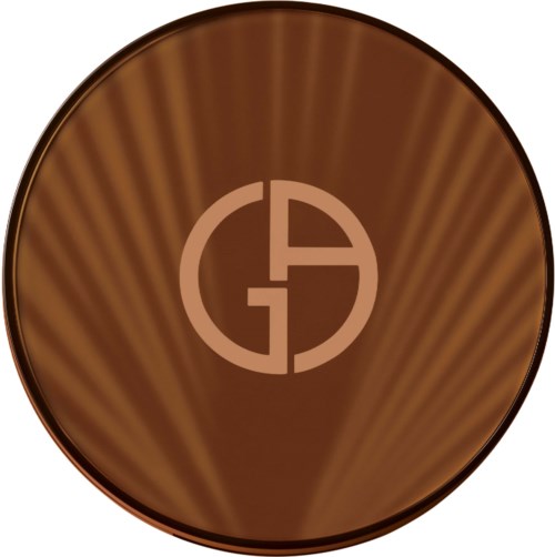 A round chocolate with a logo in the center, featuring a circle divided into four parts. The chocolate has a shiny surface.