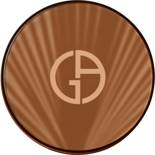 A shiny, brown, circular object with a logo in the center that looks like a combination of letters G and A.