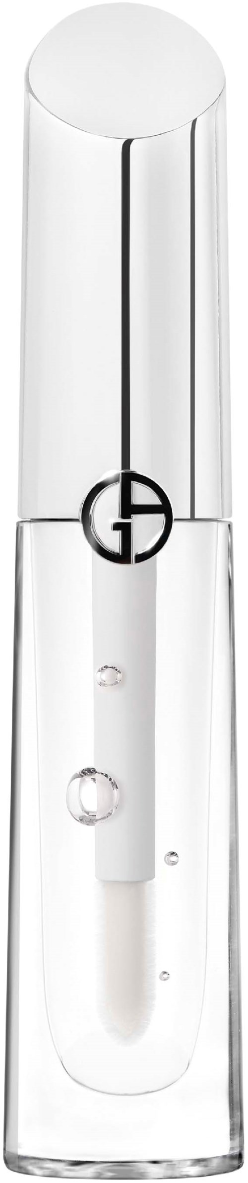 En klar, høj glasbeholder med en sort logo og en lille hvid pind indeni. Det ligner et kosmetisk produkt.