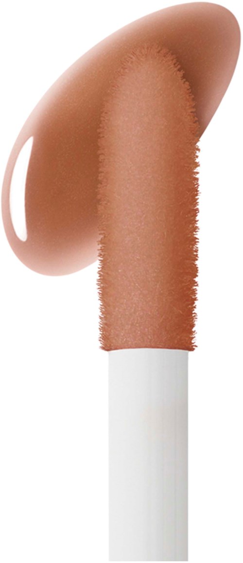 Een make-upkwastje met een beige, crèmekleurig product erop, mogelijk foundation of concealer.