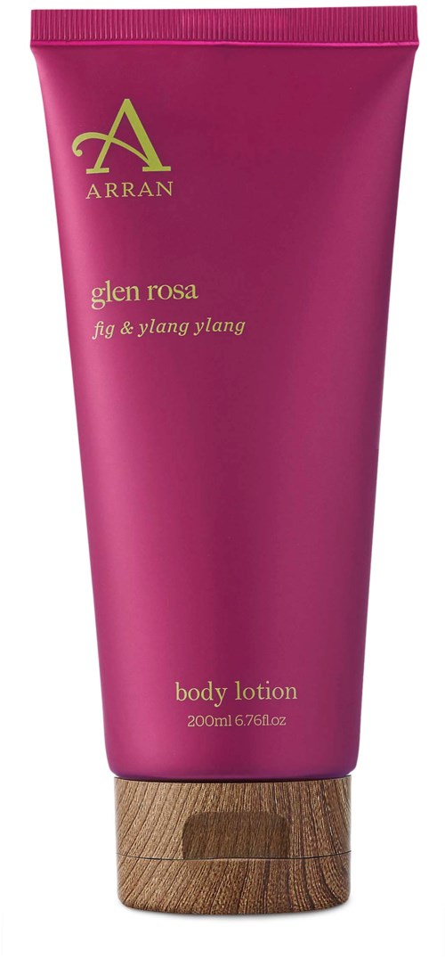 Pink tube of body lotion with a wooden cap, labeled as Arran Glen Rosa fig and ylang ylang scent.