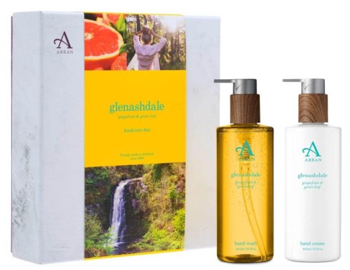 Förpackning med två flaskor hudvårdskräm, en gul och en vit, märkta 'glenashdale' med naturbilder.