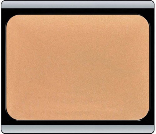 Ett beige puderlock med silver- och svart kant.