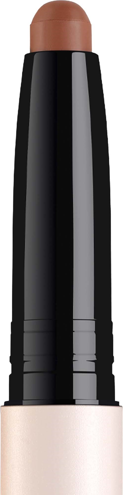 A makeup stick with a beige-colored base and a light brown tip for blending or removing makeup.