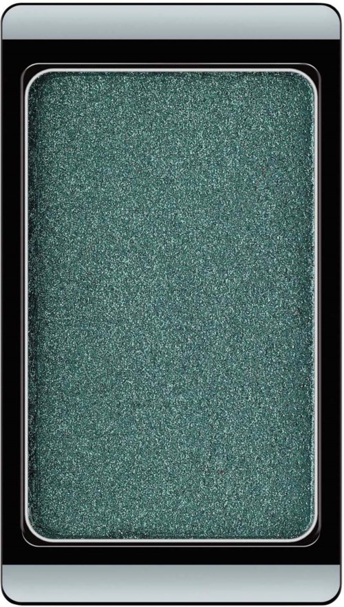 A smartphone with a glittery green eyeshadow swatch on the screen.