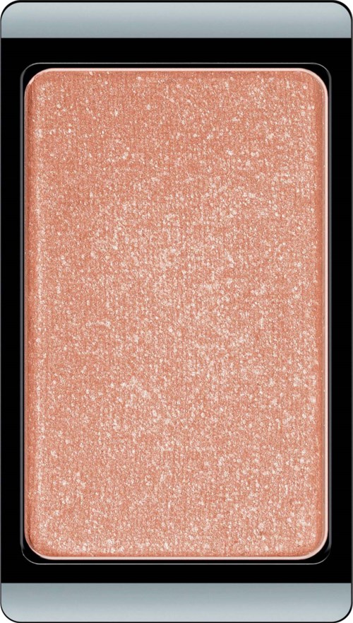 A peach-colored blush with a shimmery, glittery finish in a rectangular compact.