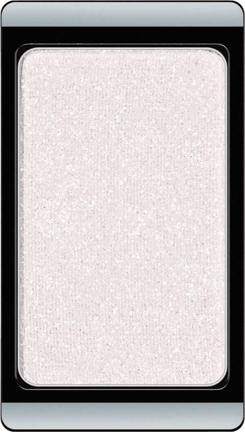 Light-colored shimmery eyeshadow inside black and silver makeup palette.
