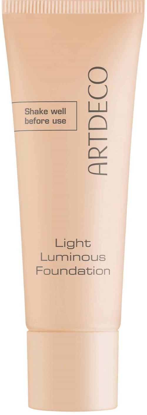 Ljus, skinluminös foundation i tub i beige färg med instruktion att skaka före användning.