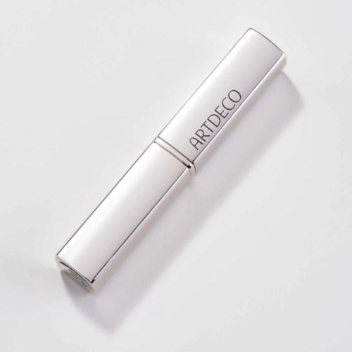 En vit sprayflaska med silverlock, märkt 'ARTDECO'.