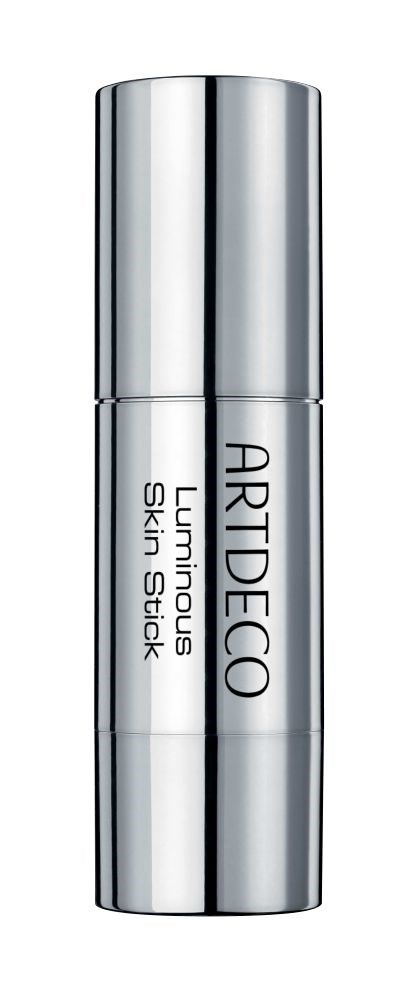 En silverfärgad, cylindrisk flaska med etiketten 'ARTIDECO Lumicrous Skin Stick' står upprätt.