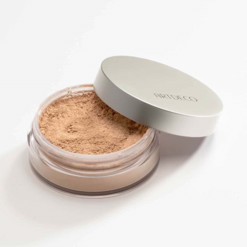 A jar of loose face powder with a silver lid, labeled 'APOTHECO', on a white background.