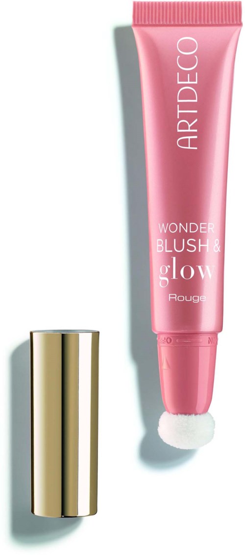 A pink tube with white and gold cap for makeup, labeled Artdeco Wonder Blush & Glow, is shown with cap off.