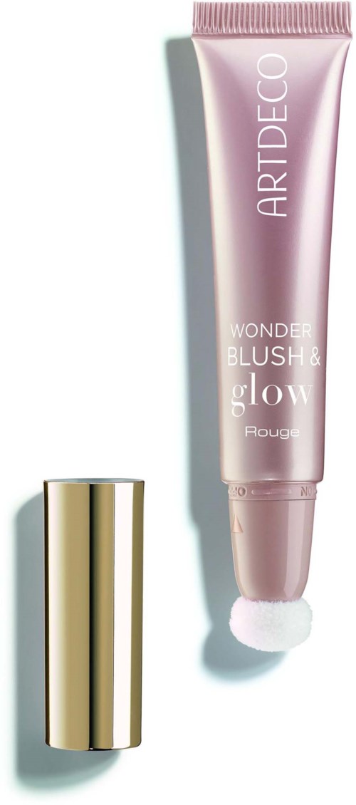 A pink tube with white text and a gold cap, likely a cosmetic product for glow and blush.