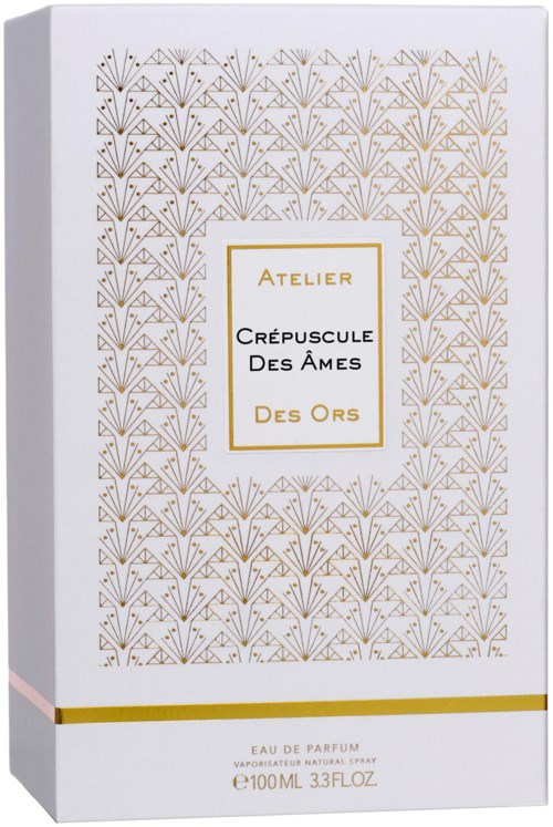 En vit för parfym med guldmönster och en etikett som säger "Atelier" och "Crépuscule Des Ames Des Ors".
