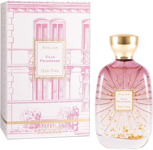 Ein Parfümflasche mit rosa Flüssigkeit und goldenen Akzenten, neben einer dekorativen Schachtel mit Gebäudezeichnung und Text.