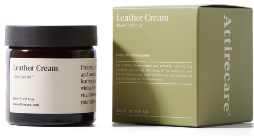 A brown jar labeled Leather Cream beside a green box with similar branding. Both are for leather care.
