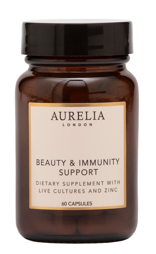 En brun flaske med svart lokk, merket "Aurelia London" for skjønnhet og immunforsvar, inneholder 60 capsules.