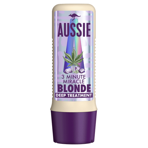 Een haarverzorgingsfles met label 'Aussie 3 Minute Miracle Blonde Deep Treatment' met een paarse en witte ontwerp en een bladgrafiek.