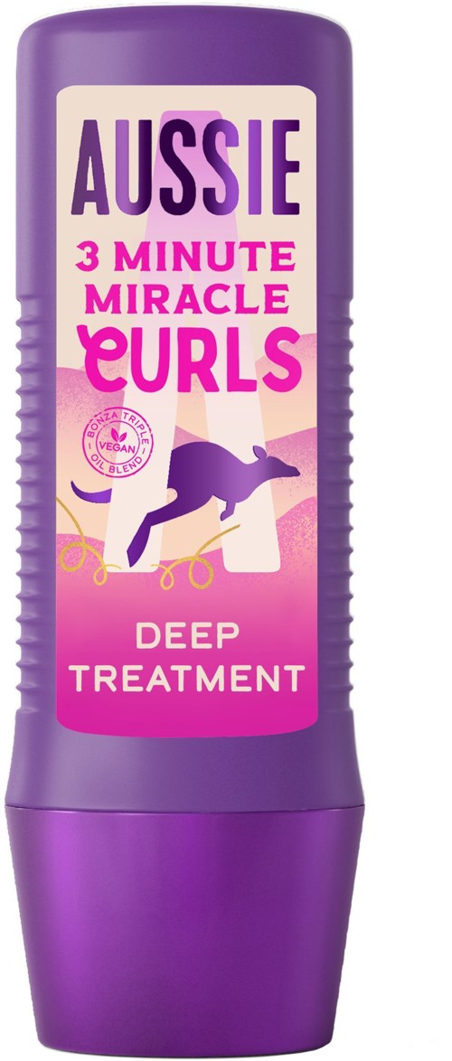 En lila flaska märkt 'Aussie 3 Minute Miracle EURLs Deep Treatment' med en hundbild och text.