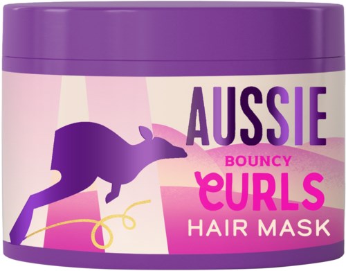 En lilla beholder med Aussie Bouncy Curls hårmaske med en hoppende hund-illustrasjon og rosa tekst.