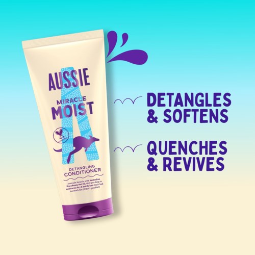 A tube of Aussie Miracle Moist conditioner with text about detangling and softening hair.
