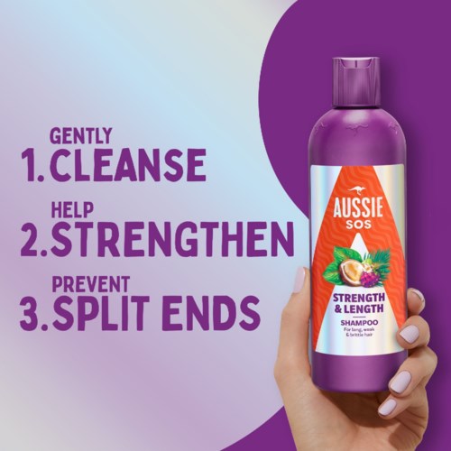 Shampoo bottle labeled Aussie SOS with a purple cap, promoting gentle cleansing, strengthening, and preventing split ends.